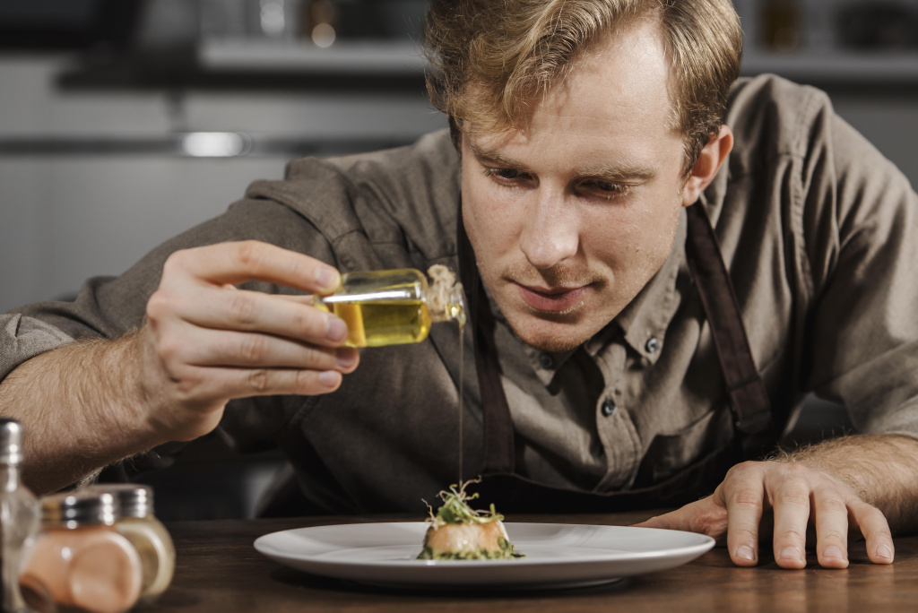 mid-shot-chef-plating-dish-with-olive-oil.jpg