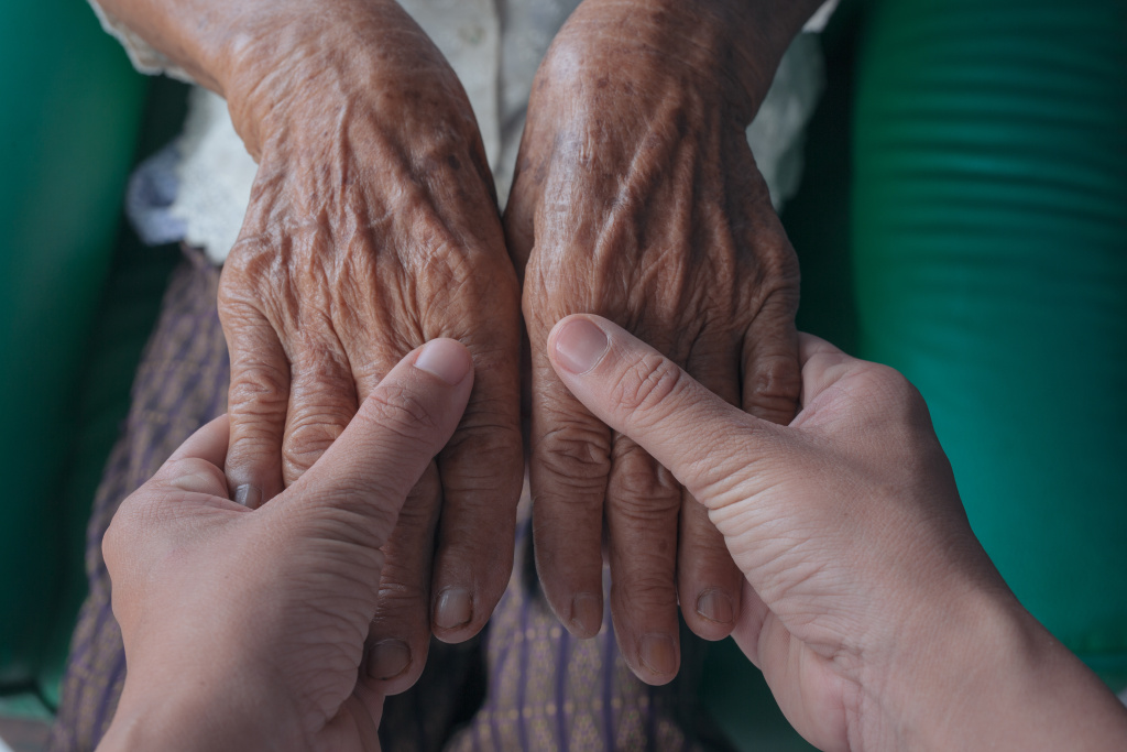 young-woman-holding-elderly-woman-s-hand.jpg young-woman-holding-elderly-woman-s-hand.jpg